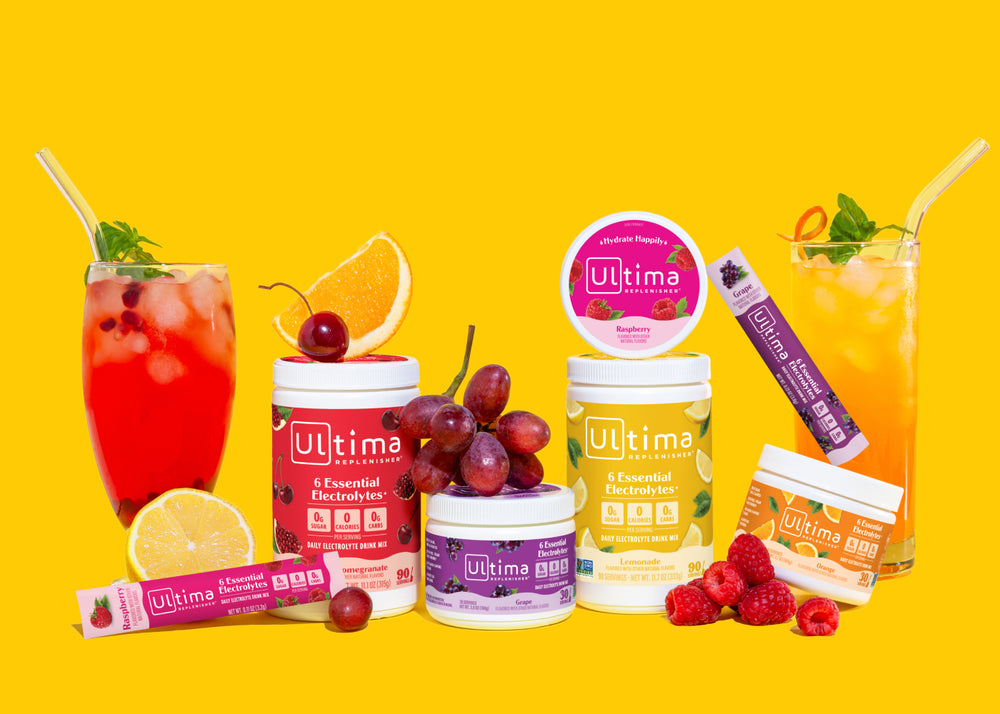 Ultima Replenisher containers and electrolyte drinks with fresh fruits and berries